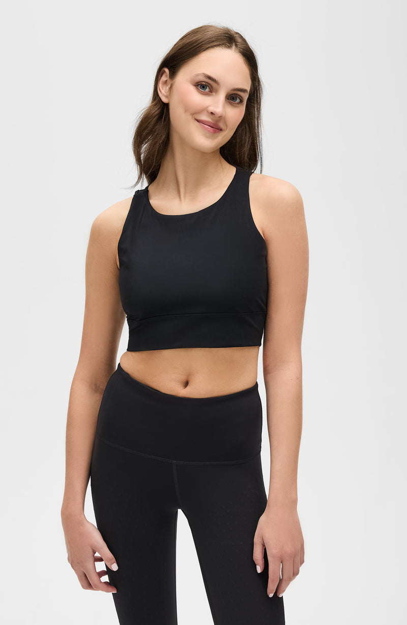 Mannequin portant la brassière The Original en noir avec des MicroPerles et un tissu de compression certifié Oeko-Tex pour améliorer la circulation, favoriser le drainage lymphatique et soulager la douleur.