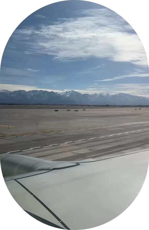 Airport runway with mountains in the background